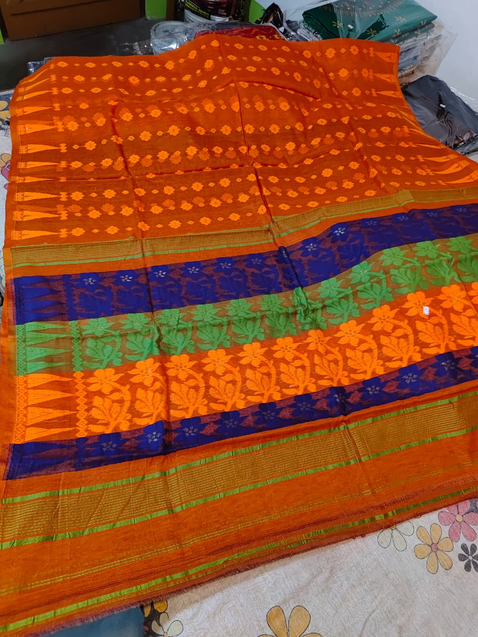 Soft Jamdani  with BP (orange body with yellow floral motifs, a blue and green contrasting border)